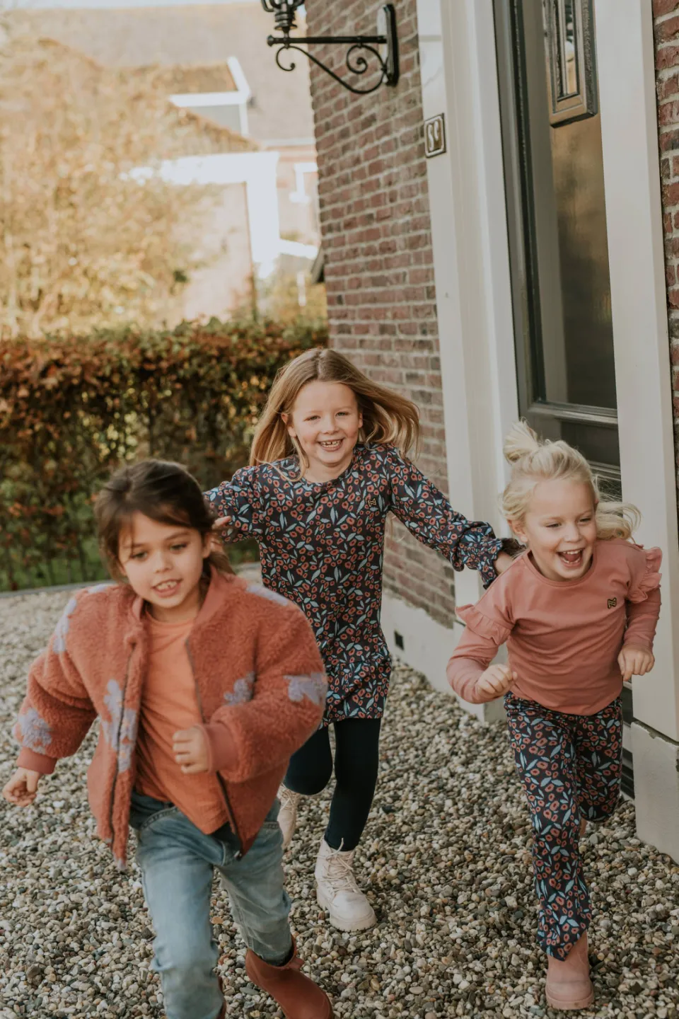 Koko Noko teddy jas met bloemenprint roodbruin